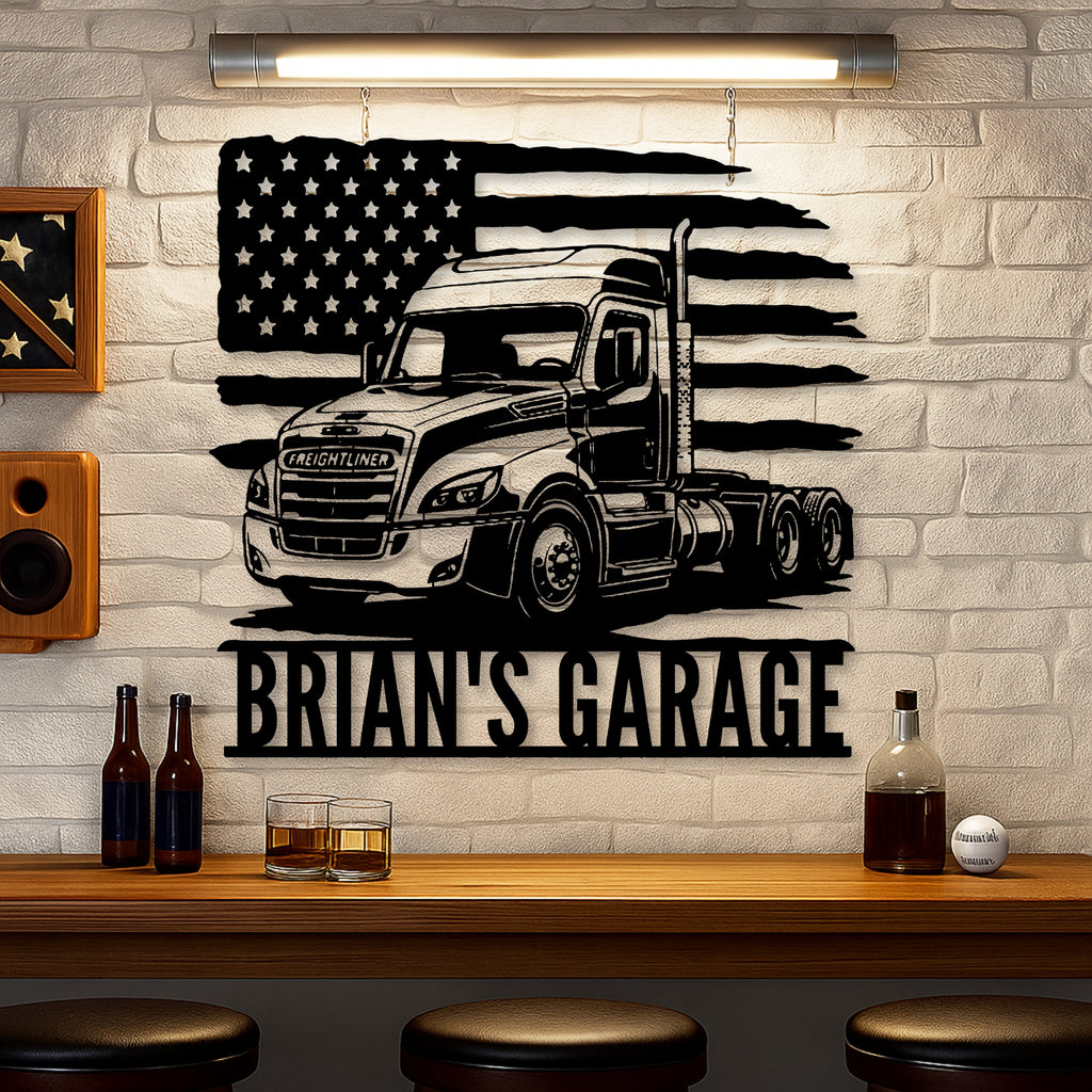 A black metal wall art piece featuring a semi-truck and an American flag with the text 'BRIAN'S GARAGE', displayed on a white brick wall above a wooden bar counter with bottles and glasses.